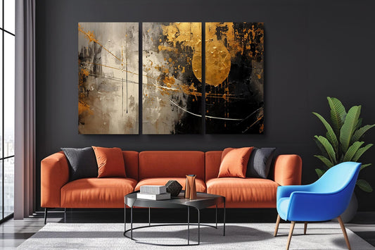 a living room with a couch and two paintings on the wall