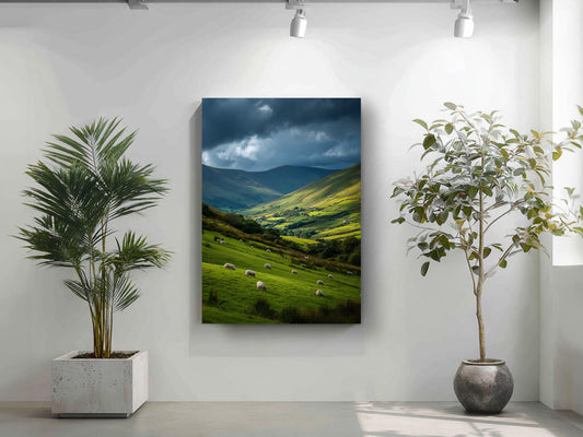 a large landscape painting hanging on a white wall, depicting a pastoral scene with rolling hills, grazing sheep, and a dramatic sky.