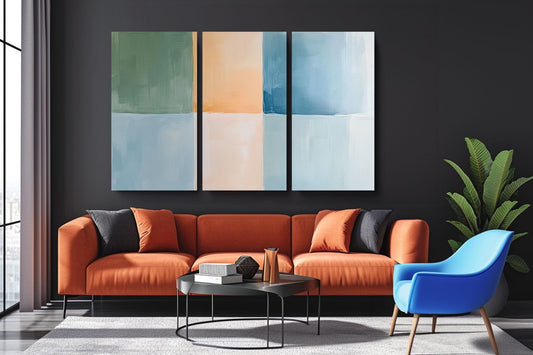 a living room with a couch and two chairs