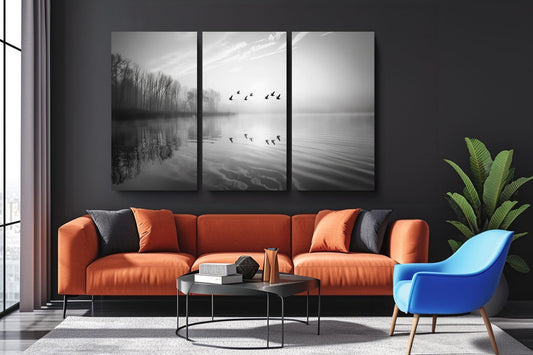 a living room with a couch a chair and a painting on the wall