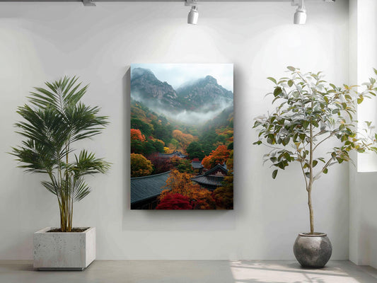 a serene indoor setting with a large painting of a mountainous landscape hanging on the wall, flanked by two potted plants.