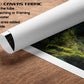 The image is a rolled canvas fabric with a printed image of a lush, green forest scene on it. The fabric is white and has a 2.5-inch edge added at each side.