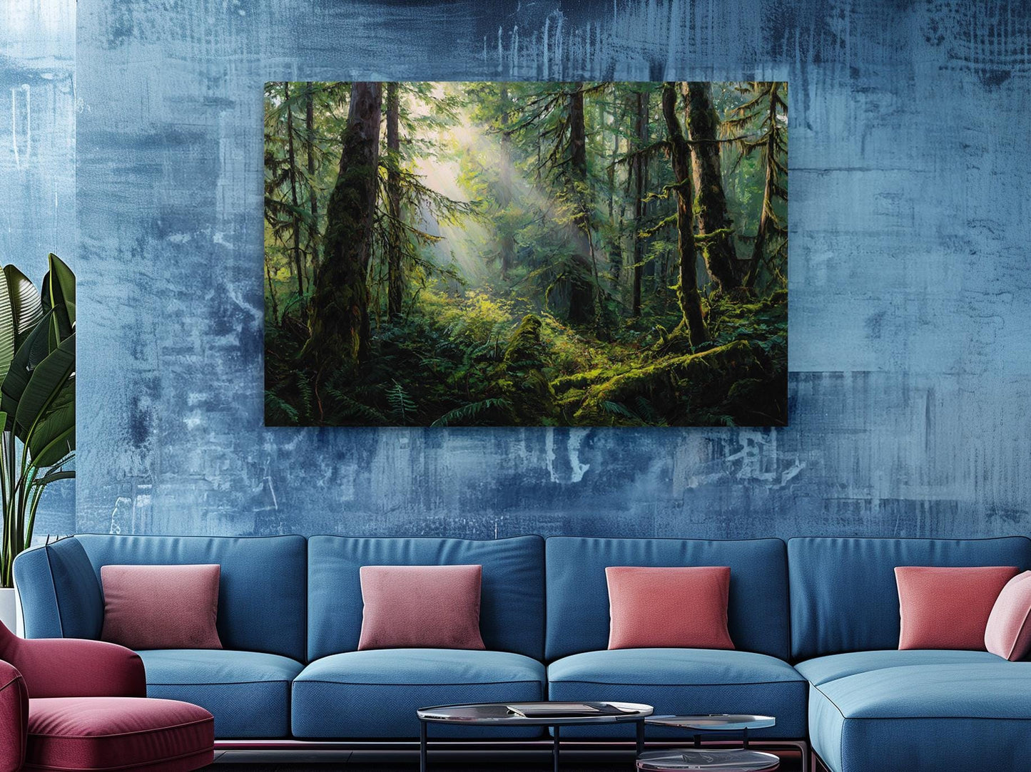 a large painting of a lush forest scene hanging on a blue wall above a blue sofa with red throw pillows.