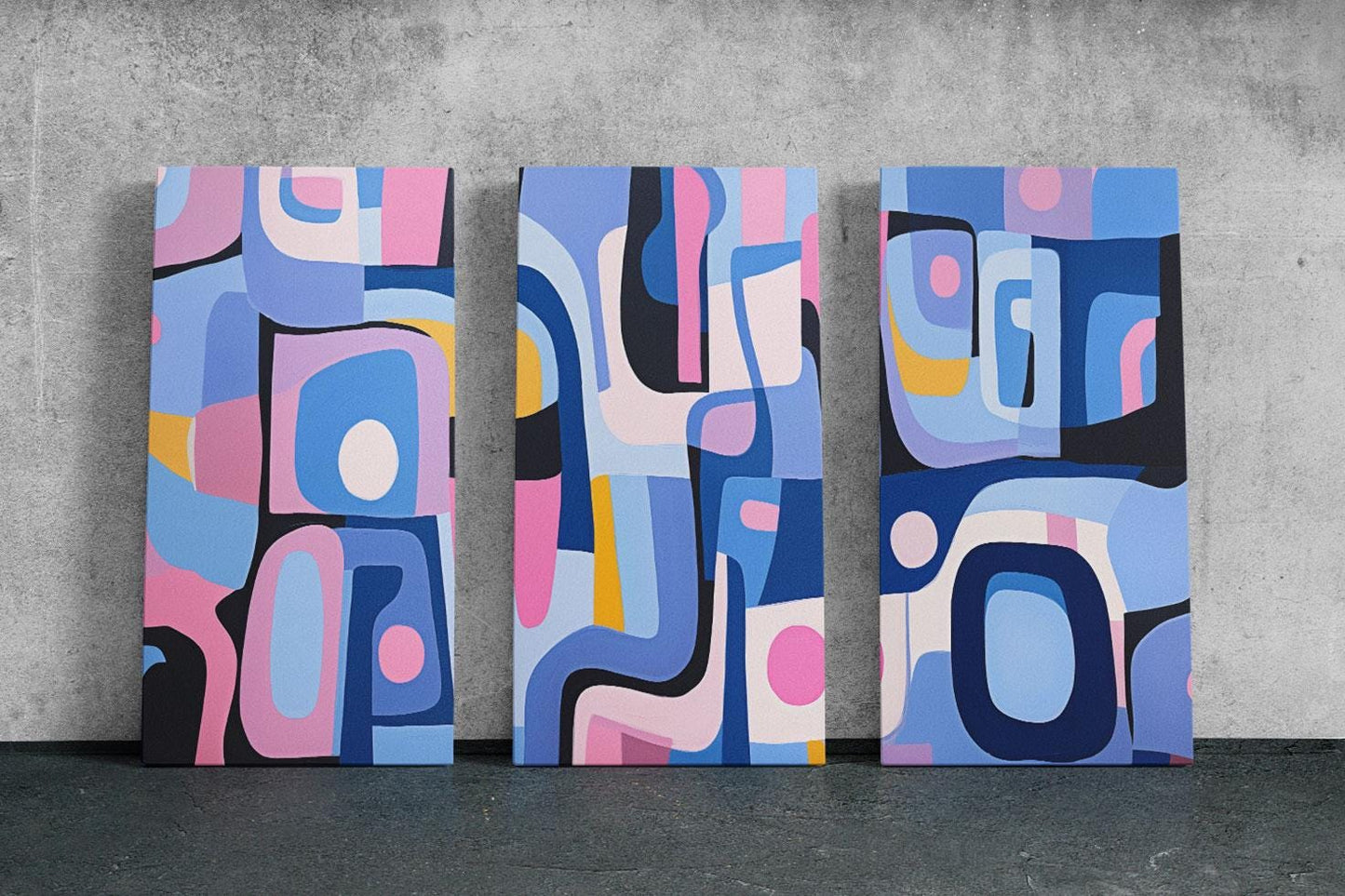 three abstract paintings on a concrete wall