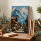 a wooden table with a painting of a mountain village, a stack of books, and several potted plants.