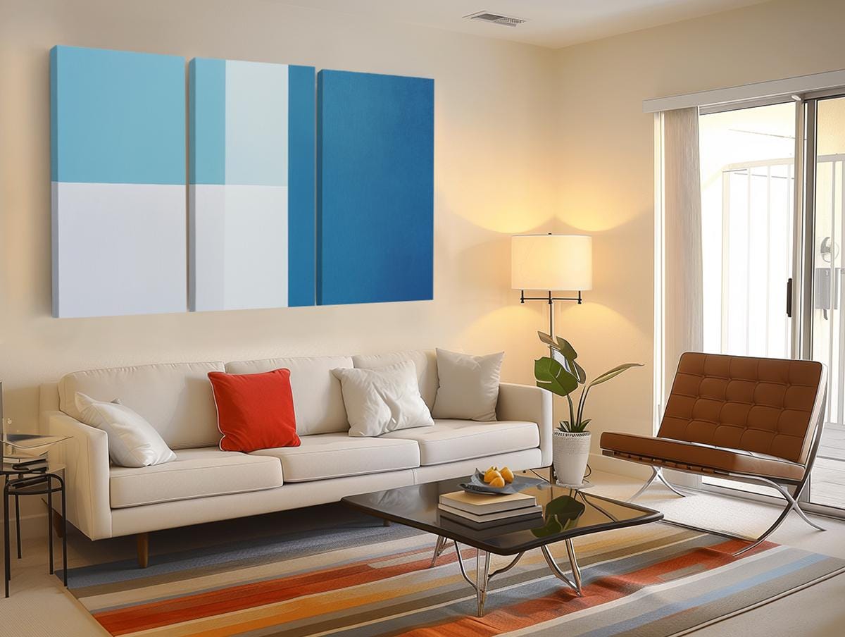 a living room filled with furniture and a painting on the wall