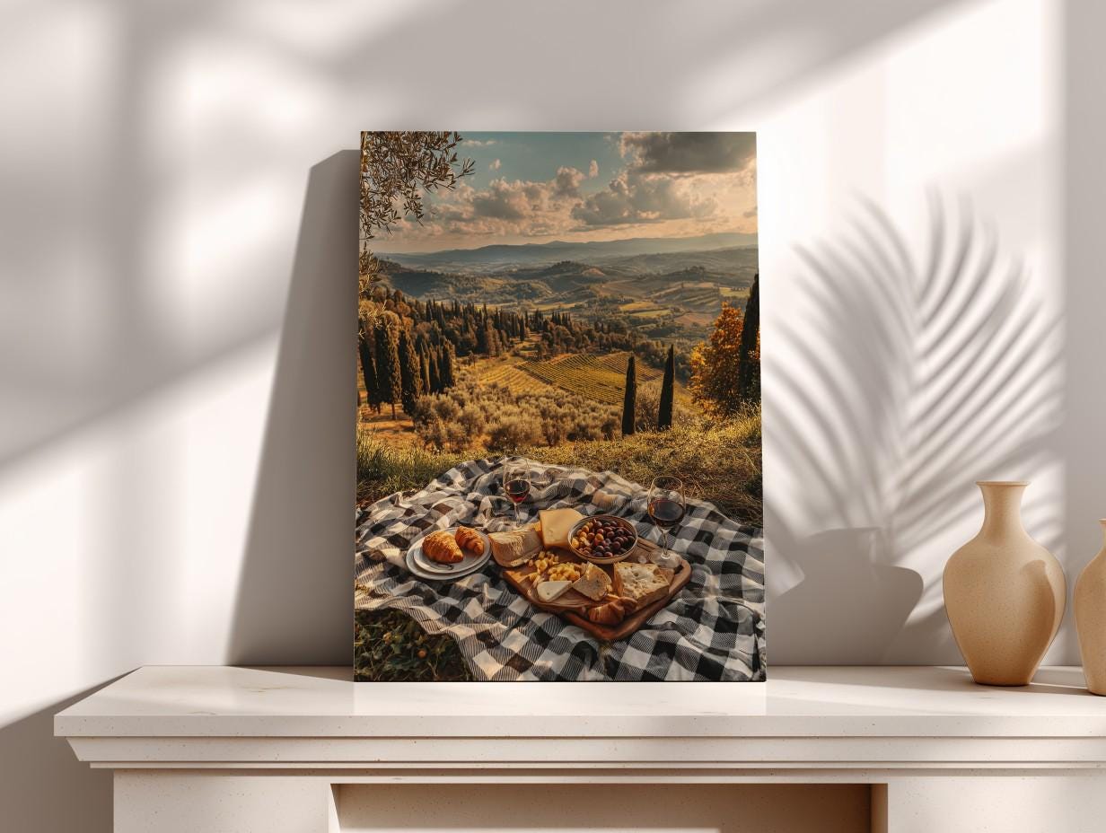 a scenic outdoor setting with a picnic blanket spread out on the grass, featuring a variety of food items such as sandwiches, fruit, and pastries. The backdrop is a picturesque landscape with rolling hills, trees, and a cloudy sky, creating a serene and inviting atmosphere.