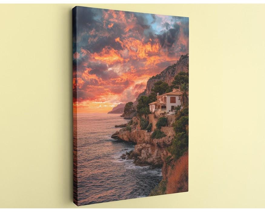 a picturesque coastal scene with a house perched on a cliff overlooking the ocean. The sky is filled with vibrant colors, suggesting a stunning sunset or sunrise. The house is nestled among the rocky cliffs, creating a serene and idyllic atmosphere.
