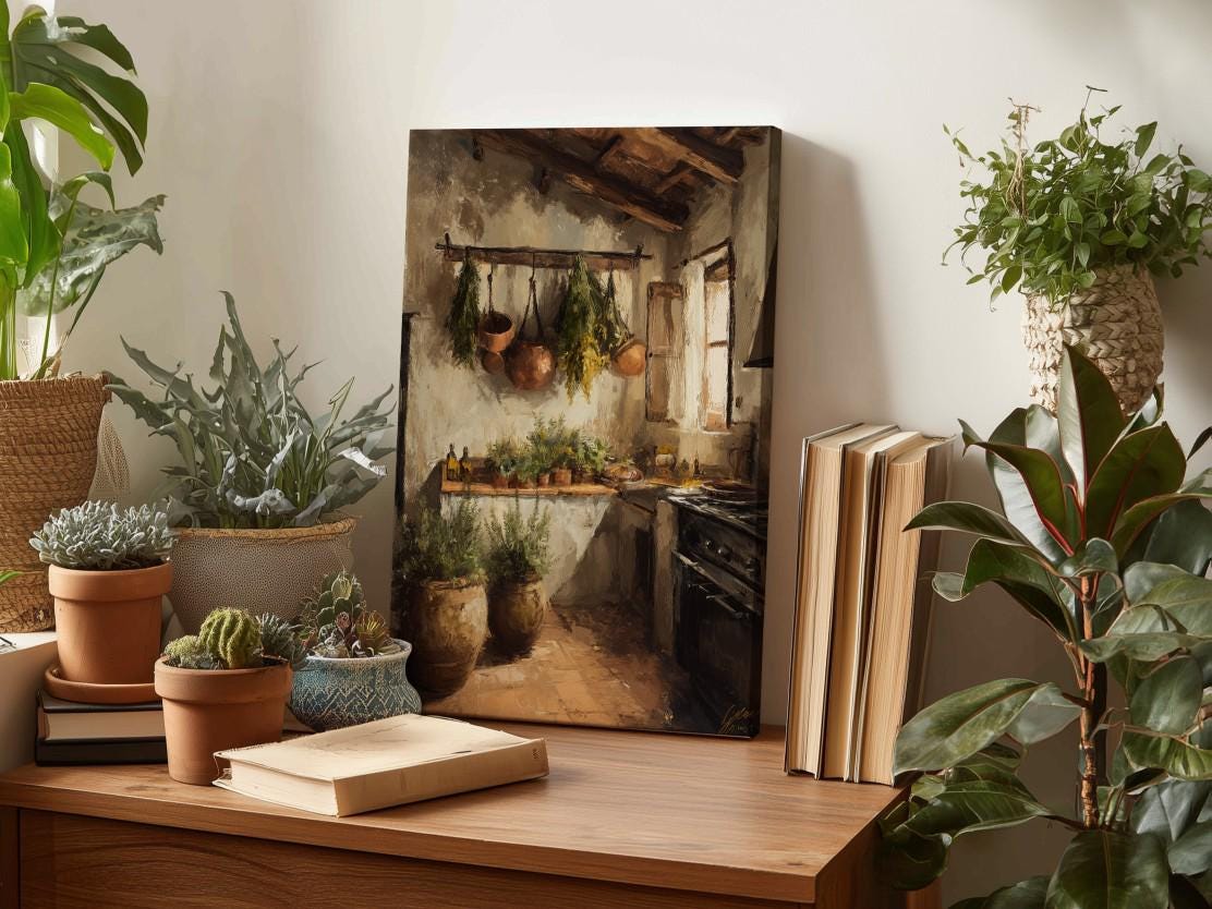 a cozy kitchen scene with hanging pots and pans, surrounded by lush greenery and potted plants. A painting of a kitchen is displayed on a wooden shelf, and a stack of books is placed nearby.