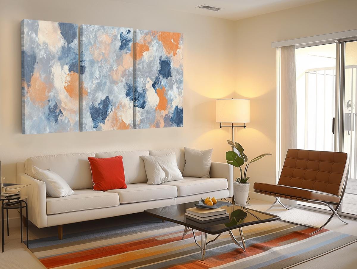 a living room filled with furniture and a painting on the wall