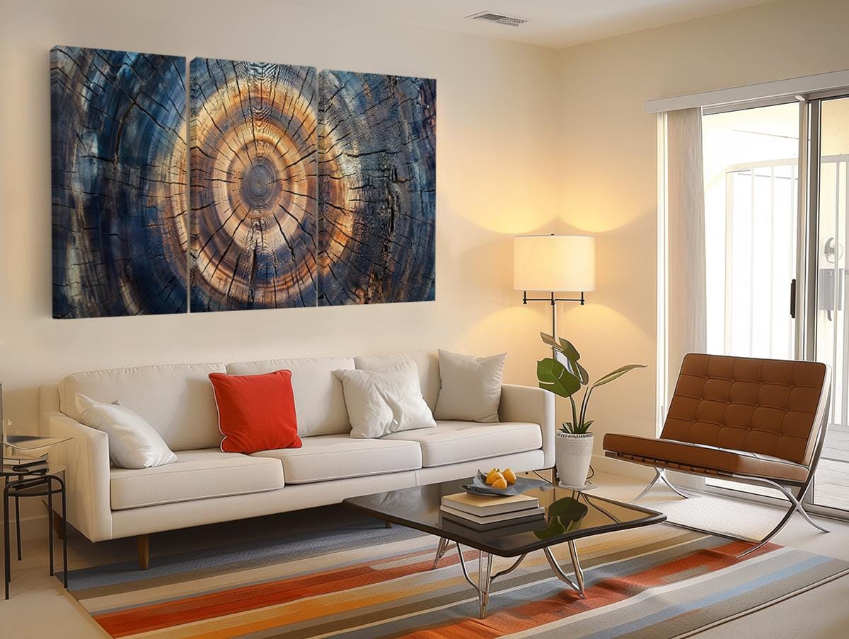 a living room filled with furniture and a painting on the wall