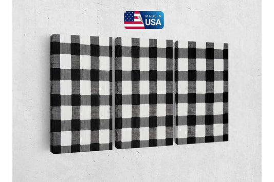 a black and white checkered wall hanging on a wall