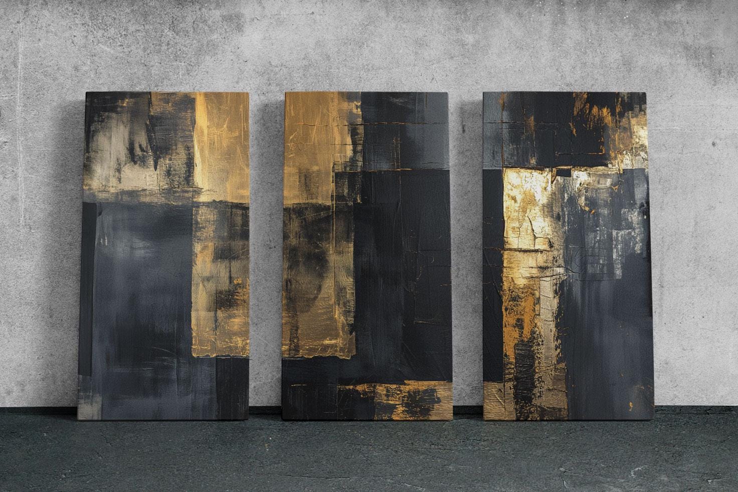 a group of three black and gold paintings on a wall