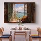 a dining room with a table set for four, featuring a vase of flowers and a basket of fruit. Above the table, there is a large painting of an open window overlooking a beach with a cityscape in the background.