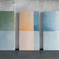 three paintings of different colors on a wall