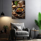 a cozy living room with a comfortable gray armchair, a wooden side table, and a potted plant. Above the armchair, there is a framed photograph of a hearty stew with bread and vegetables, creating a warm and inviting atmosphere.