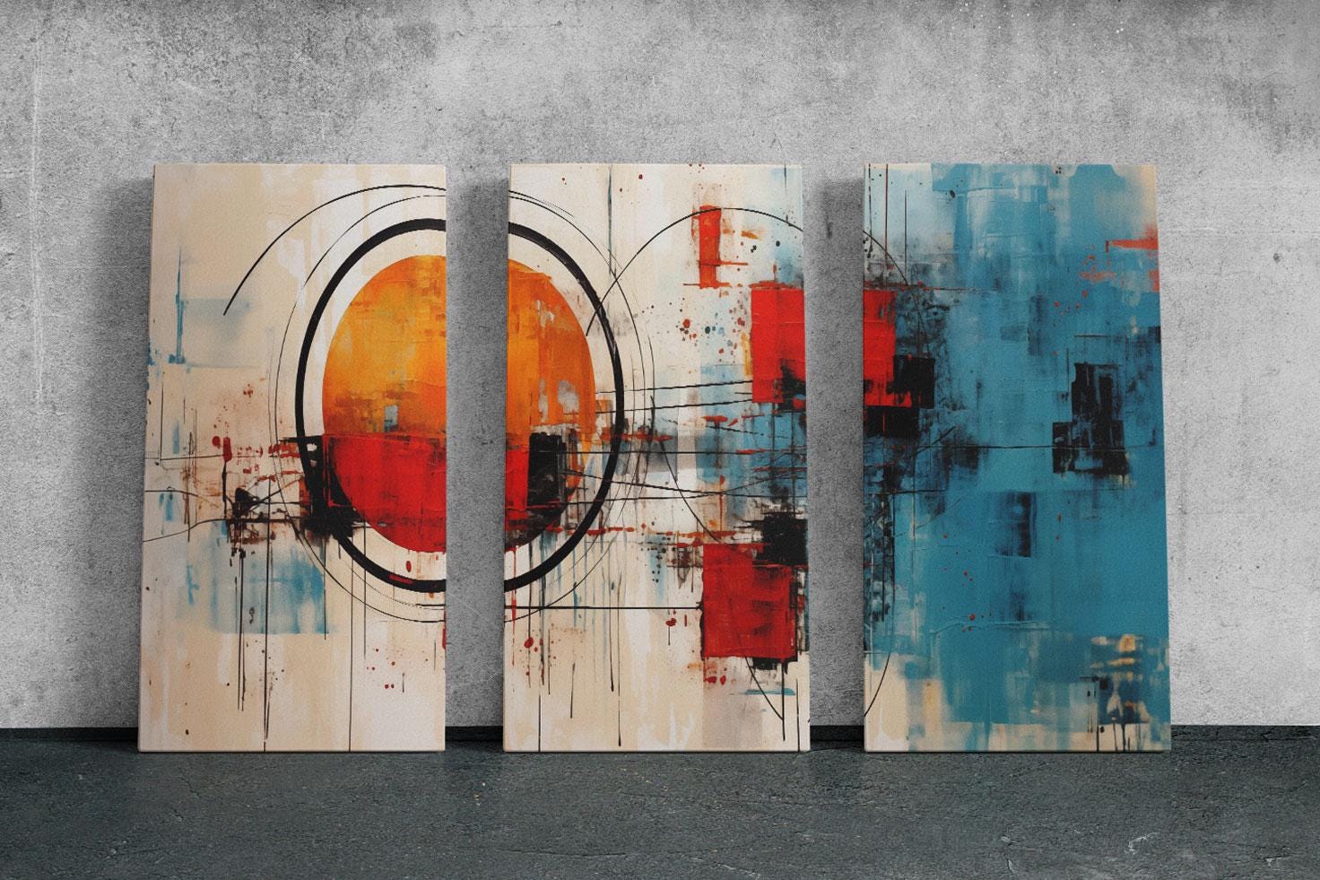 three abstract paintings on a wall in a room