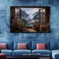 a large painting of a mountain landscape with a window overlooking a valley, hanging on a blue wall above a blue couch with pink pillows.