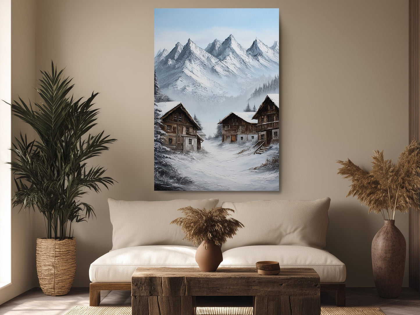 a cozy living room with a large painting of a snowy mountain village hanging on the wall. The painting features two wooden houses nestled among the snow-covered mountains, creating a serene and picturesque scene. The room is decorated with a plush sofa, a wooden coffee table, and potted plants, adding warmth and comfort to the space.