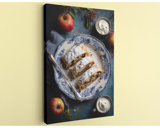 A blue and white patterned plate holds a pastry, accompanied by a bowl of whipped cream and two whole apples on a table.