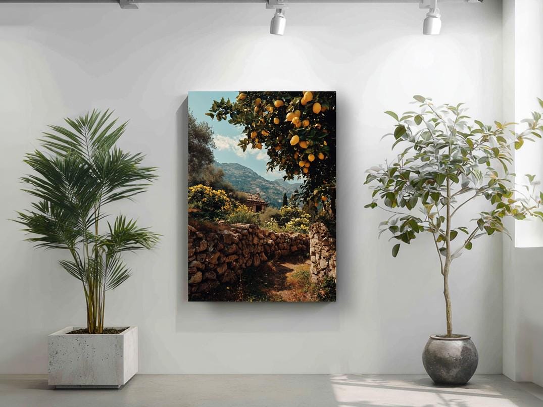 a serene indoor setting with a large painting of a stone wall and a tree with orange fruits hanging on the wall, flanked by two potted plants.