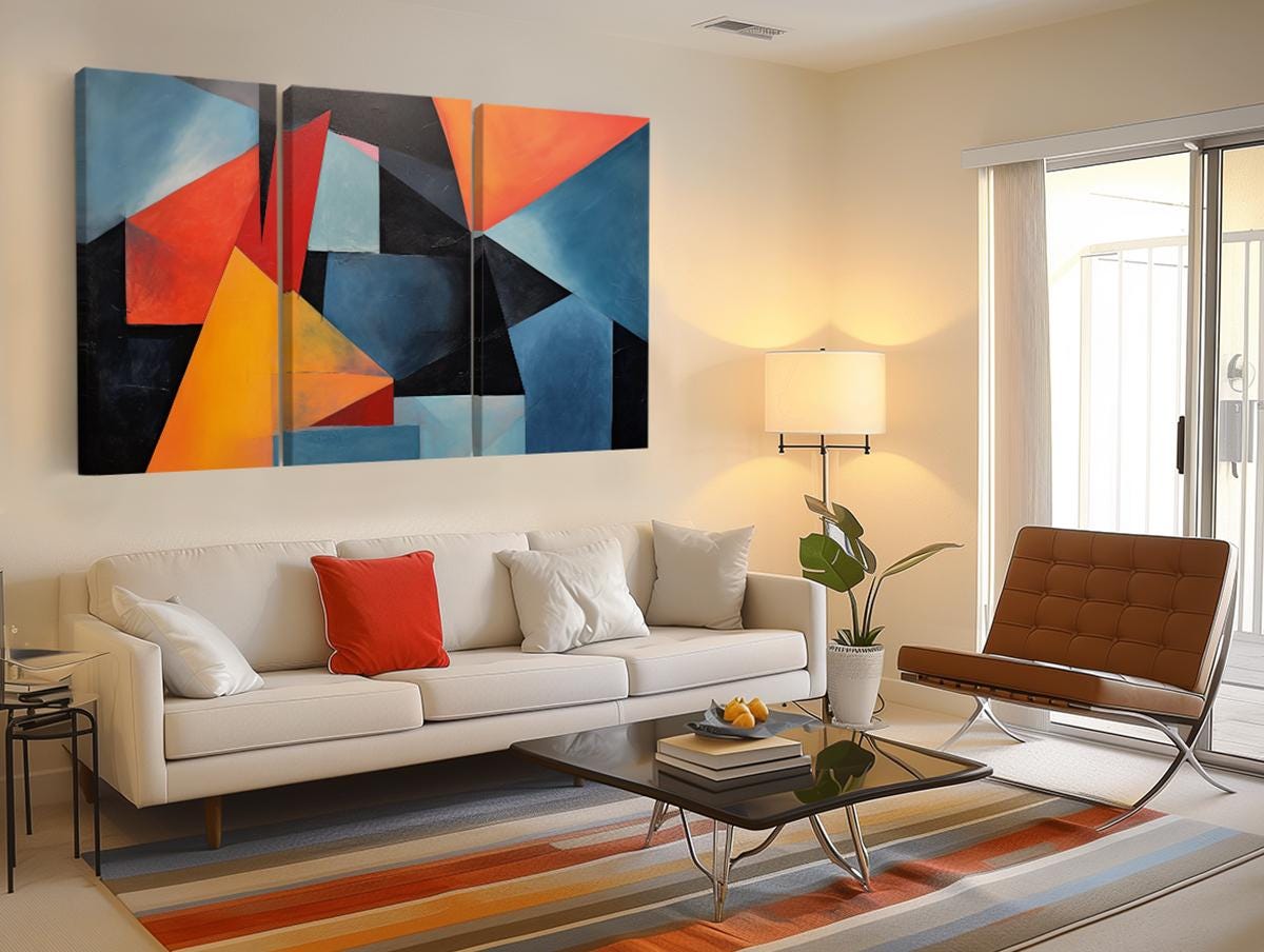 a living room filled with furniture and a painting on the wall