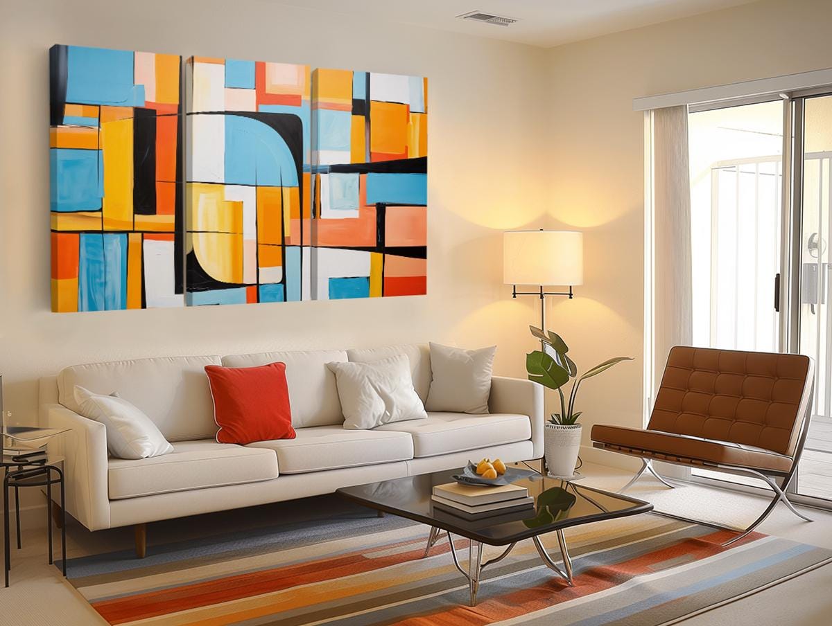 a living room filled with furniture and a painting on the wall