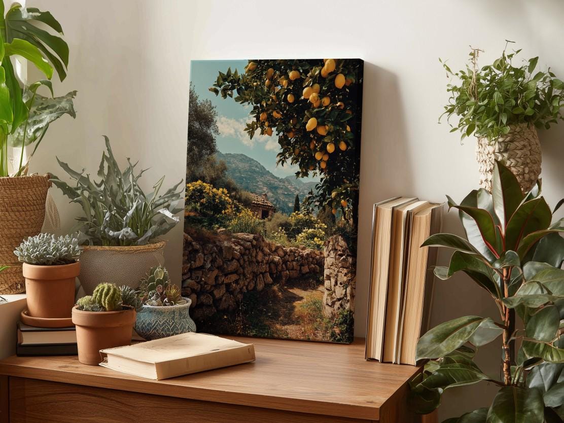 a wooden desk with a painting of a garden scene, surrounded by potted plants and books.