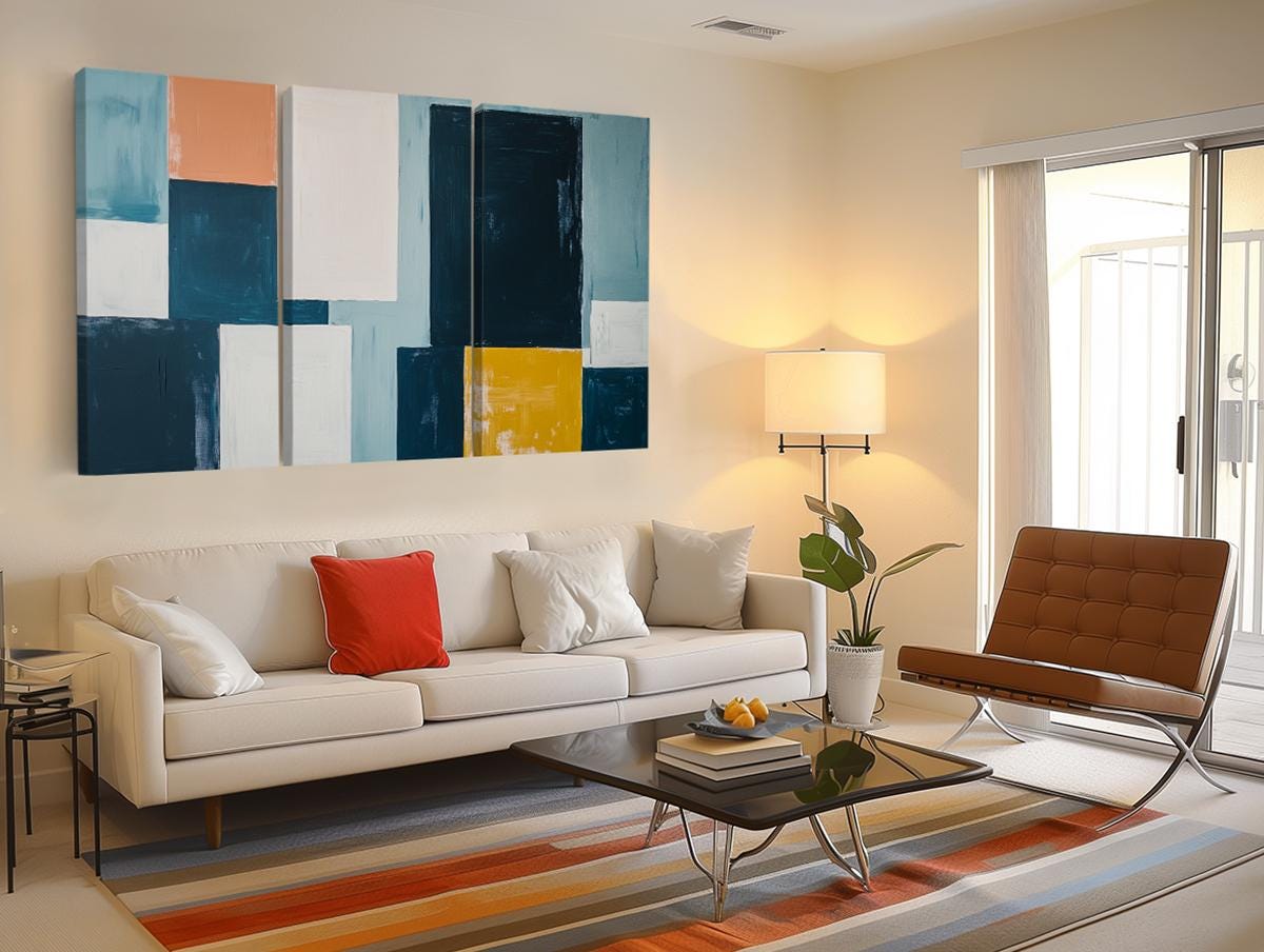 a living room filled with furniture and a painting on the wall