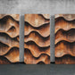 three wooden panels with wavy designs on them