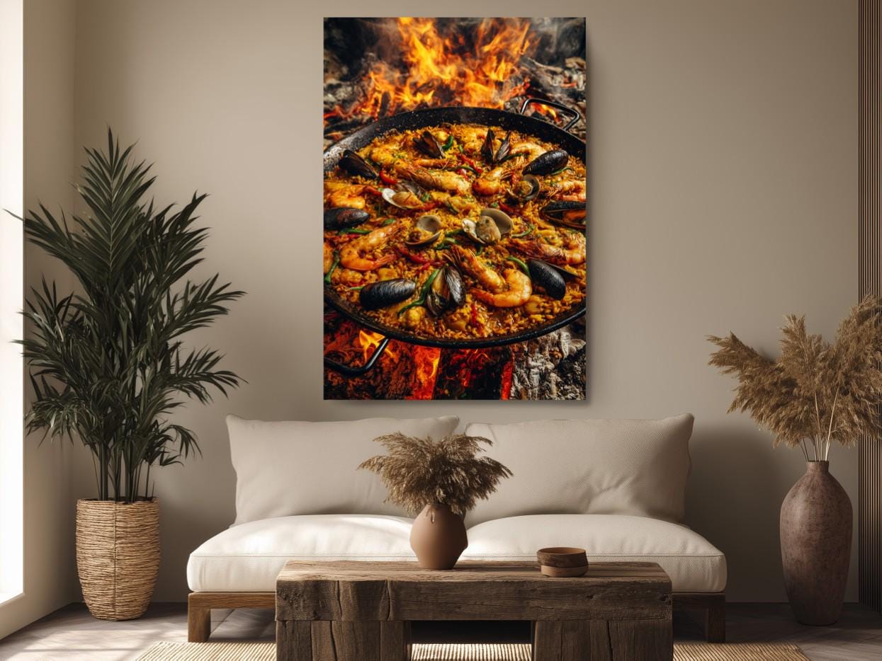 a large, appetizing seafood paella dish with shrimp, mussels, and other ingredients, displayed on a table with a vase of dried flowers in the foreground.