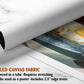 The image is a rolled canvas fabric, which is a type of canvas material used for creating posters or wall art. It is described as a tube-delivered fabric, which means it is delivered in a tube and requires stretching before use. The fabric can be used as a poster and includes a 2.5&quot; edge area.