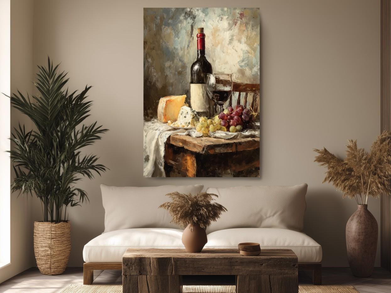 a cozy living room with a large painting of a table set with wine, cheese, and grapes hanging on the wall above a white sofa.