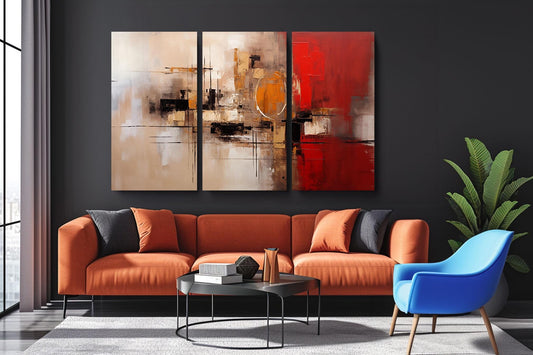 a living room with a couch, chair and paintings on the wall