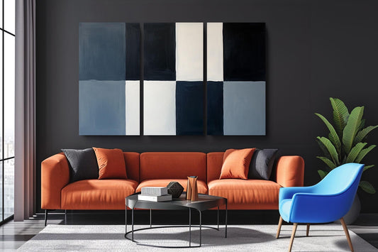 a living room filled with furniture and a painting on the wall