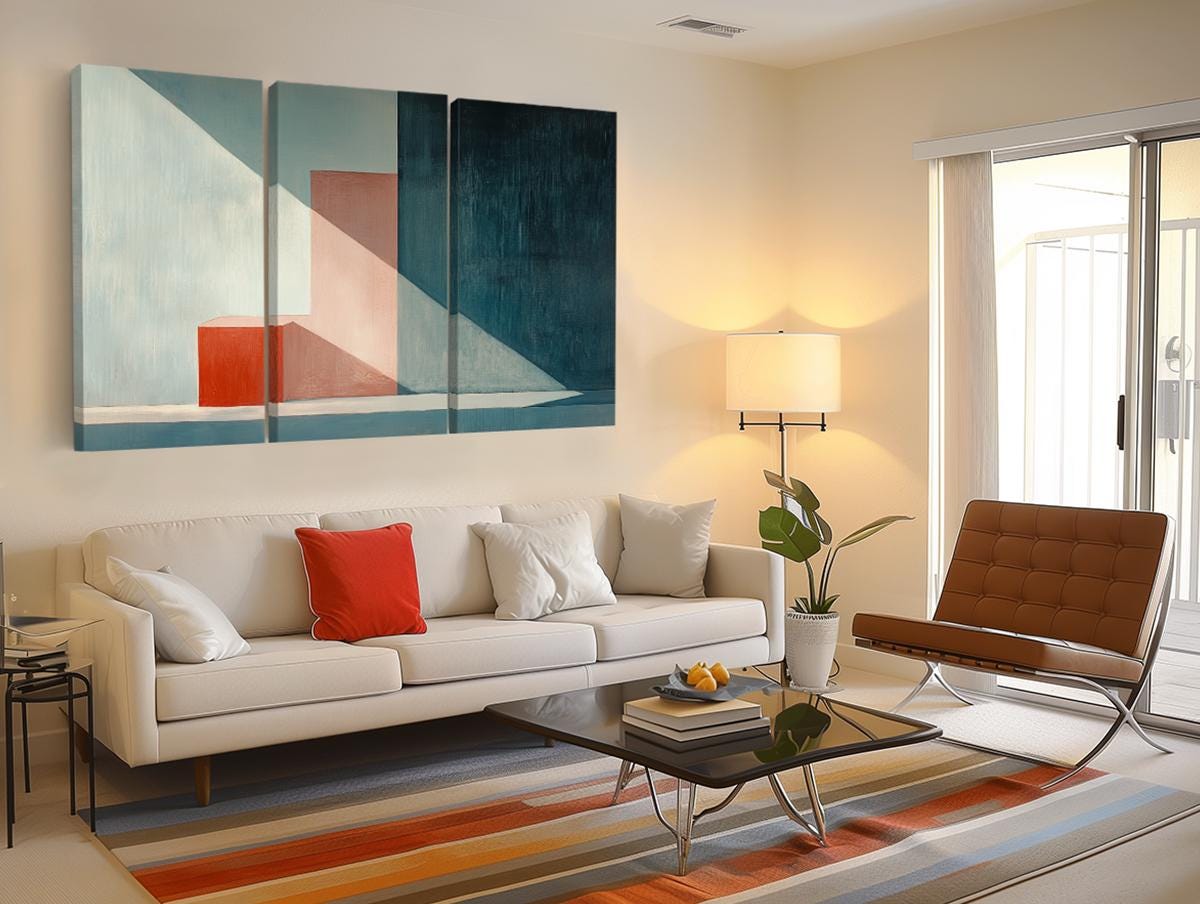 a living room filled with furniture and a painting on the wall
