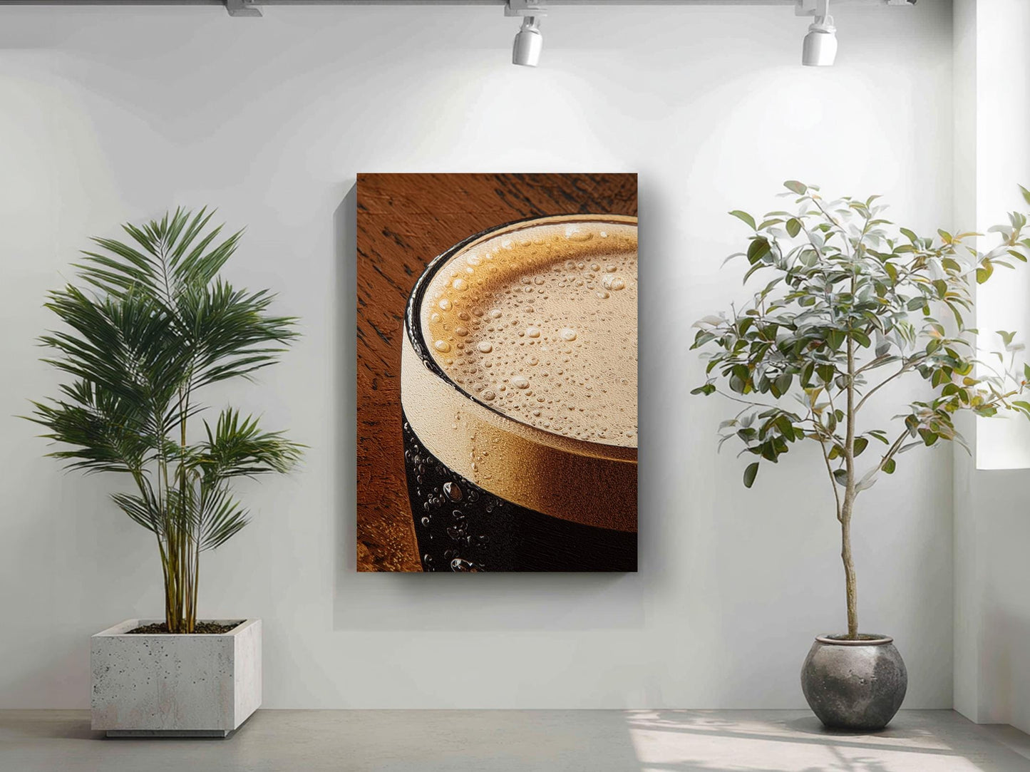 a close-up of a glass of beer with a foamy head, accompanied by two potted plants in a minimalist setting.