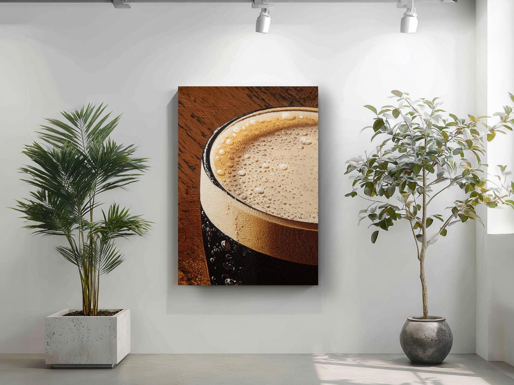a close-up of a glass of beer with a foamy head, accompanied by two potted plants in a minimalist setting.