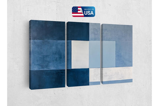 a blue and white abstract painting on a wall