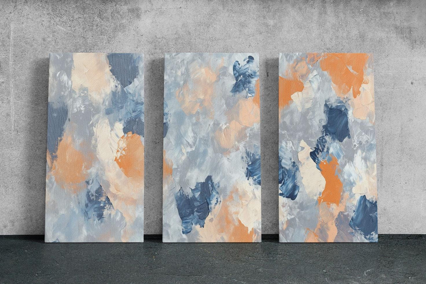 three abstract paintings on a concrete wall