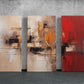 three abstract paintings on a wall in a room