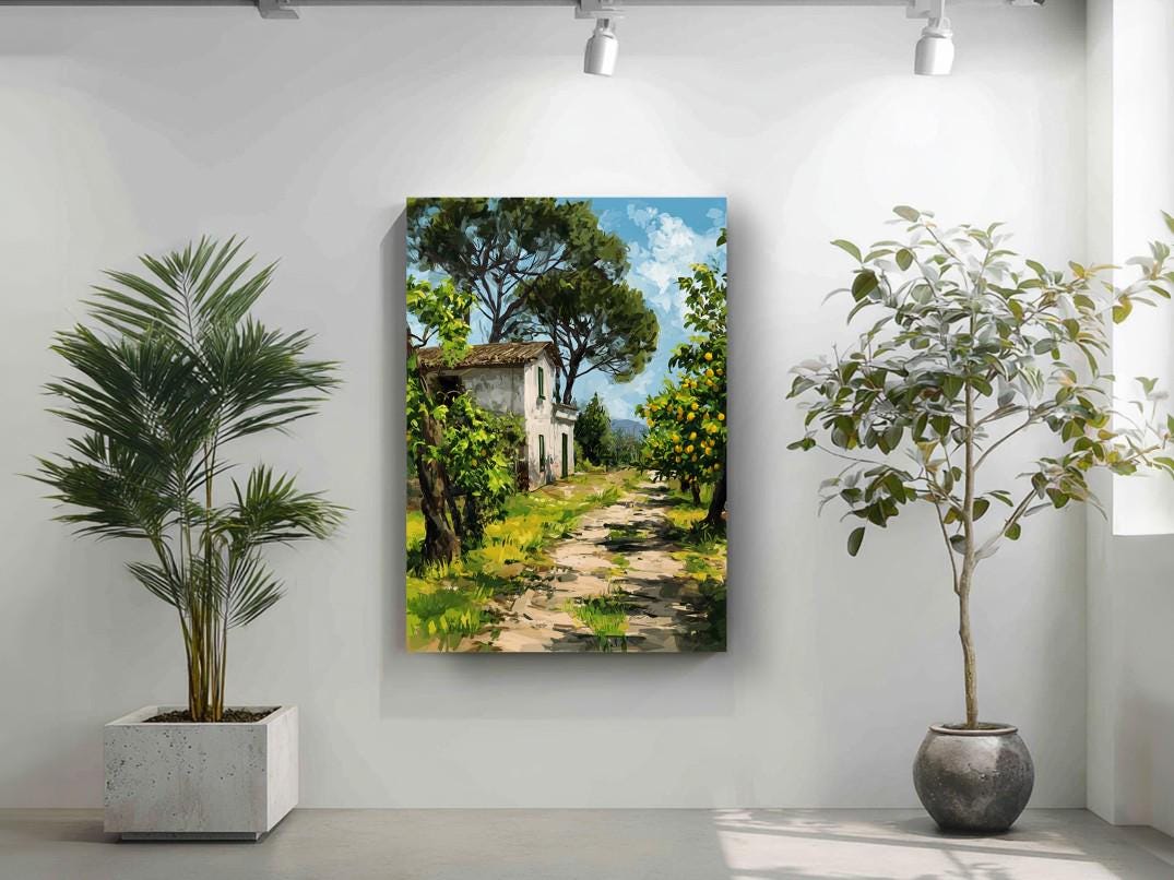 a painting of a house on a path surrounded by trees, hanging on a white wall. Two potted plants are placed on either side of the painting, creating a serene and natural atmosphere in the room.