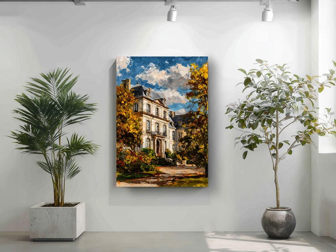 a large painting of a white house with a blue roof, surrounded by trees and a path, hanging on a white wall. Two potted plants are placed on either side of the painting, creating a balanced and harmonious composition.