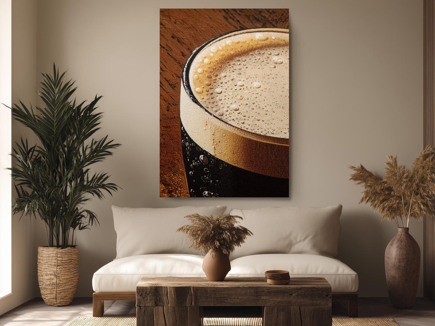 a cozy living room with a large framed photograph of a glass of beer hanging on the wall above a wooden coffee table. The room is decorated with potted plants, a vase, and a rug, creating a warm and inviting atmosphere.