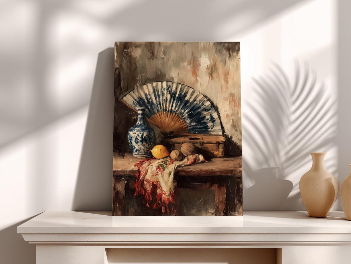 a still life painting of a table with a blue and white vase, a fan, a lemon, and a box.