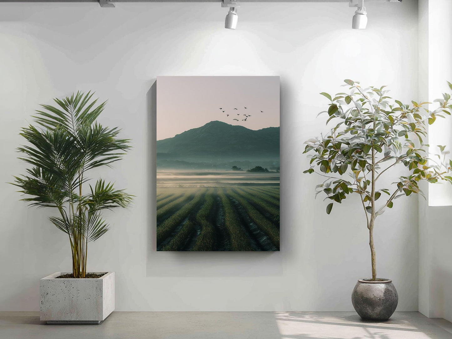 a serene landscape with a field of crops and a mountain in the background, as depicted in a framed artwork hanging on a wall.