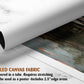 The image is a rolled canvas fabric, which is a type of canvas material used for painting or printing. It is described as a tube-delivered fabric, which means it is delivered in a tube and requires stretching before use. The fabric can be used as a poster, with a 2.5&quot; edge area.