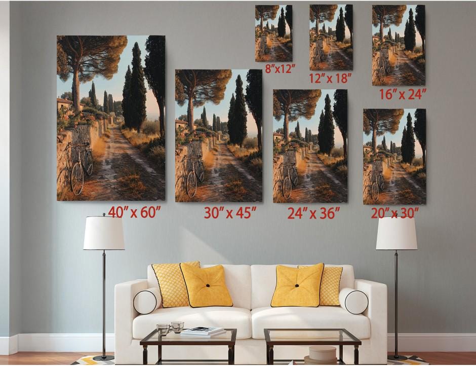 The image is a living room with a white sofa and a coffee table. Above the sofa, there are six identical paintings of a scenic countryside landscape, each with a different size and orientation. The paintings are arranged in a grid-like pattern on the wall, with each one depicting a different view of the countryside. The paintings are labeled with their respective sizes in inches, providing a visual guide for the viewer.