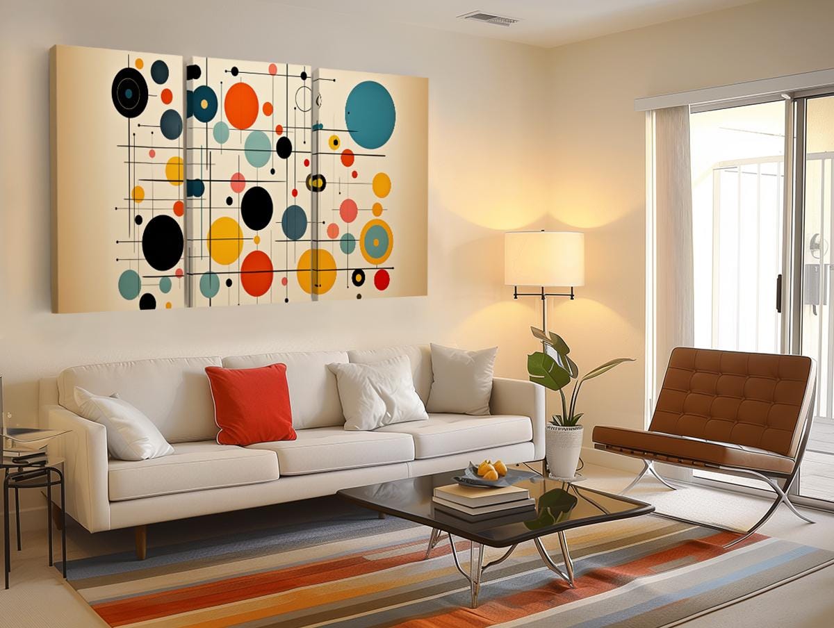 a living room filled with furniture and a painting on the wall