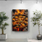a large pan of seafood paella, with a fire underneath it, creating a dramatic effect. The pan is filled with various types of seafood, including shrimp, mussels, and clams, all cooked together in a traditional Spanish paella. The image is displayed on a wall, with a potted plant to the left and a plant to the right, adding a touch of greenery to the scene.